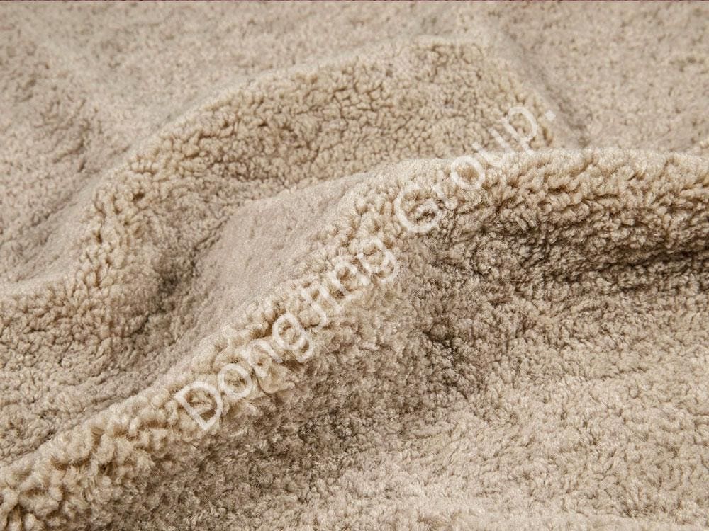 What are the advantages of Apricot Teddy Faux Fur Fabric's 100% polyester content?