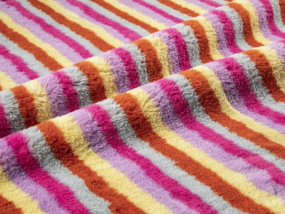 Is the imitation rabbit fur fabric warm?