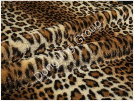Unleashing Wild Elegance: Embrace the Chic Appeal of Beige Indian Leopard Print Faux Fur Fabric.