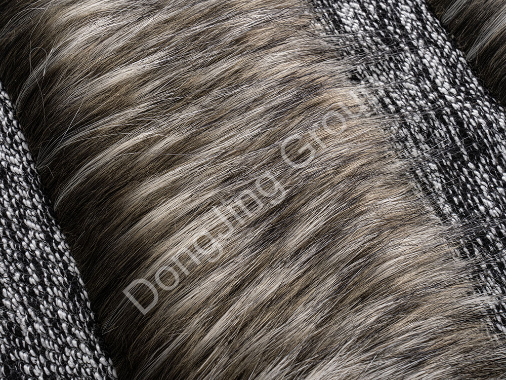 How does Jacquard technology give Two Color Jacquard Fur Tips Faux Fur Fabric its unique charm?