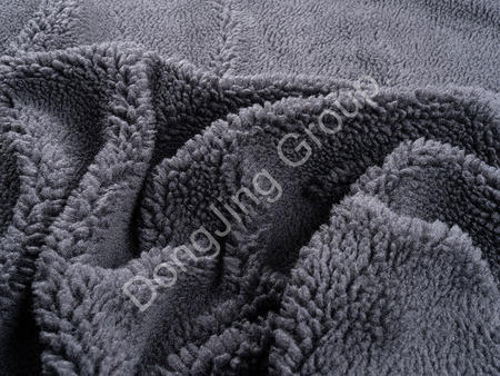 How warm is the black gray rolling ball cloth faux fur fabric?